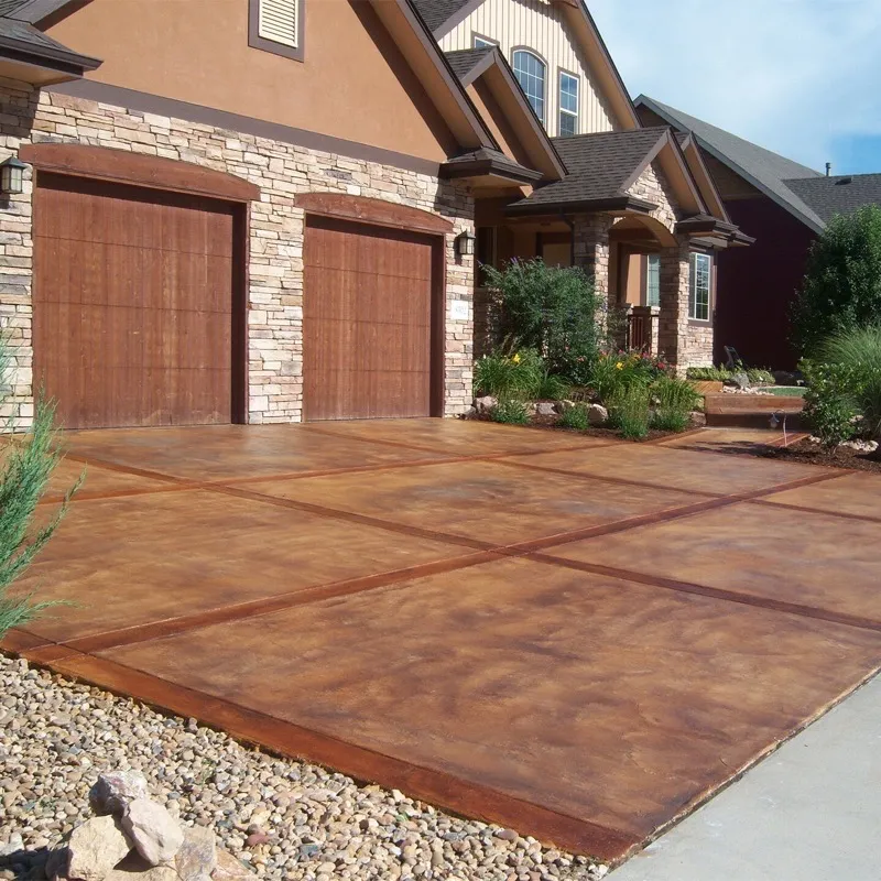 Stained concrete overlay driveway with scored 4-panel pattern