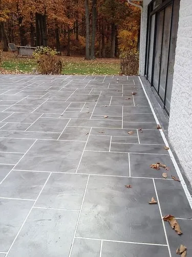 Cementitious overlay patio with custom slate-tile pattern and grout lines