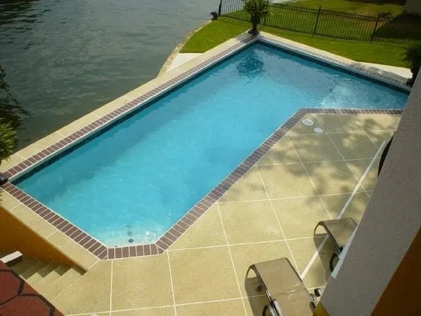 Textured slip-resistant pool deck coating in a light sand color
