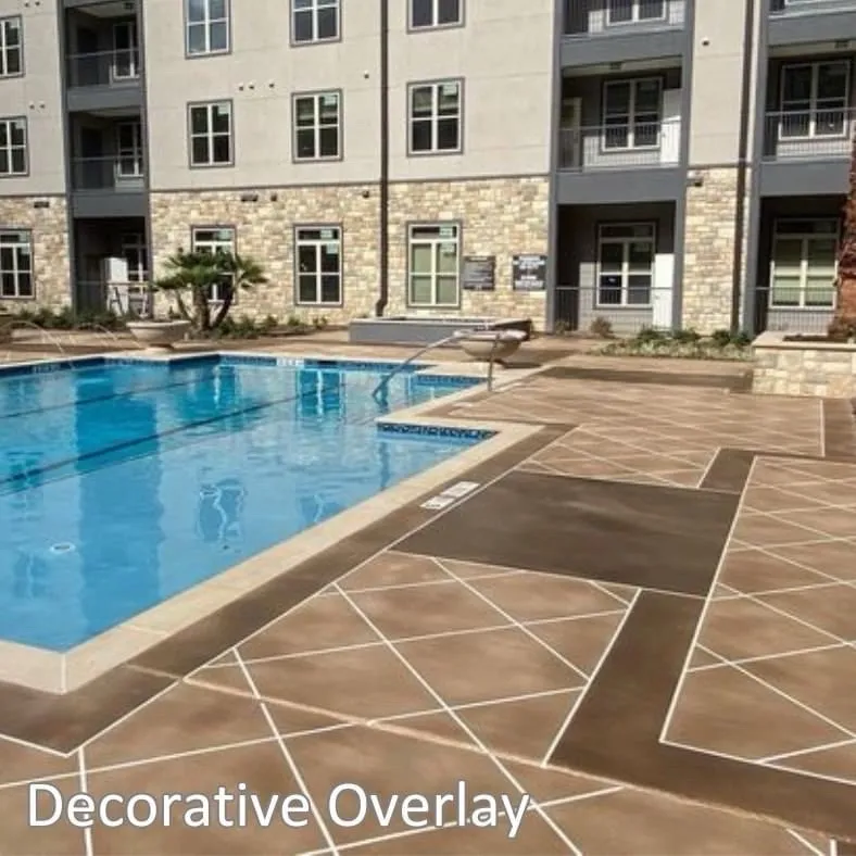 Decorative concrete overlay with custom tile-pattern scoring on a Memphis pool deck